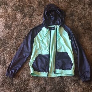 Teal/black wind breaker